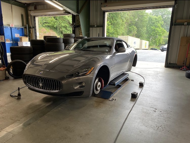 Vehicle on lift in professional service garage